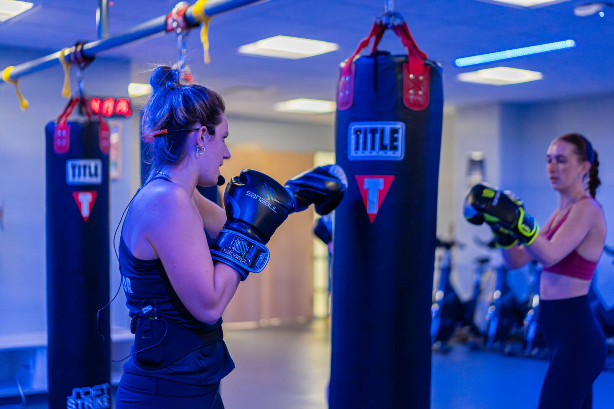 Woman kickboxing during a group exercise class. 